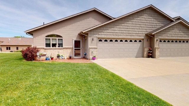 1720 Hale Dr, Albert Lea, MN 56007 - view of front of house featuring a garage, concrete driveway, a front yard, and brick siding