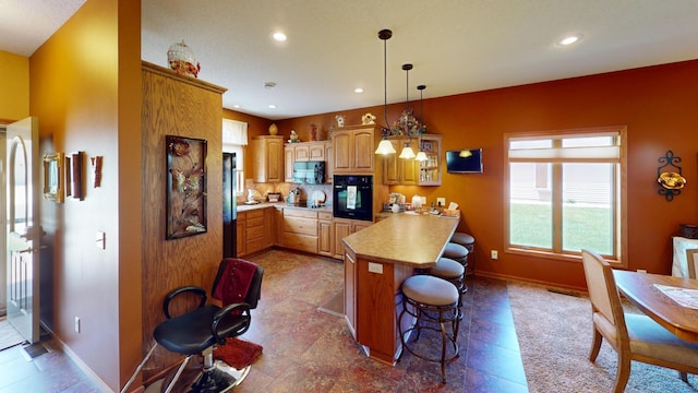 1720 Hale Dr, Albert Lea, MN 56007 - kitchen featuring black appliances, a peninsula, a kitchen breakfast bar, recessed lighting, and baseboards