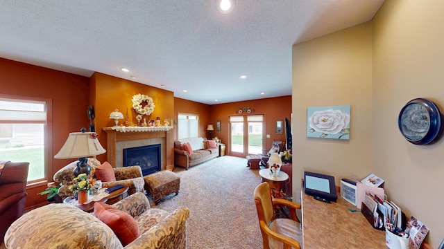 1720 Hale Dr, Albert Lea, MN 56007 - carpeted living area featuring a glass covered fireplace, recessed lighting, and a textured ceiling
