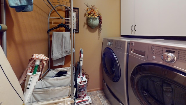 1720 Hale Dr, Albert Lea, MN 56007 - laundry room with washer and clothes dryer, cabinet space, light stone finish flooring, and baseboards