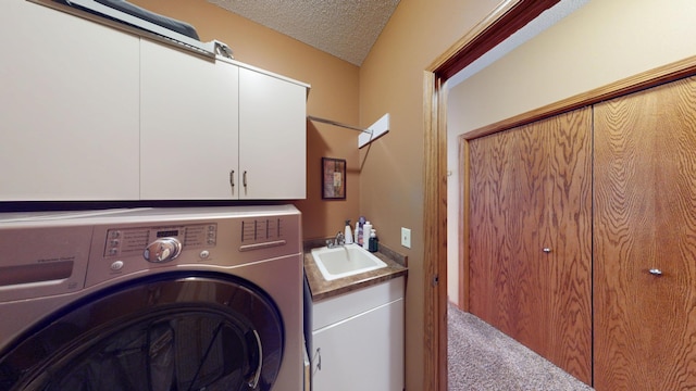 1720 Hale Dr, Albert Lea, MN 56007 - laundry room featuring washer / dryer, cabinet space, a textured ceiling, and carpet floors