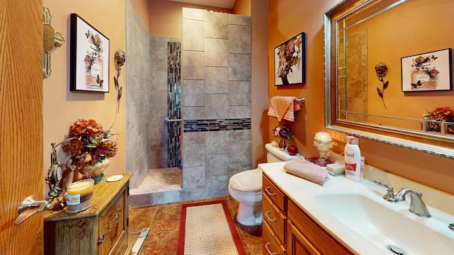 1720 Hale Dr, Albert Lea, MN 56007 - bathroom featuring toilet, a tile shower, vanity, and tile patterned flooring