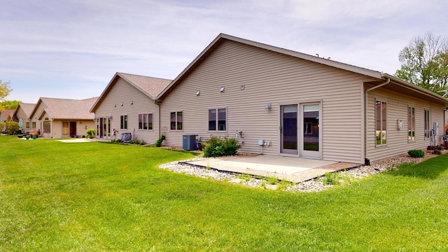 1720 Hale Dr, Albert Lea, MN 56007 - back of house with a patio area, a lawn, and central air condition unit