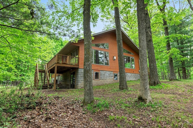 568 26th Ave, Cumberland, WI 54829 - view of property exterior with stairway and a wooden deck