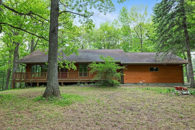 568 26th Ave, Cumberland, WI 54829 - rear view of house with a wooden deck and roof with shingles