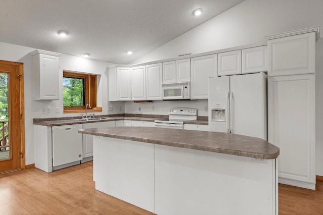 568 26th Ave, Cumberland, WI 54829 - kitchen featuring white appliances, a sink, lofted ceiling, white cabinets, and light wood-style flooring