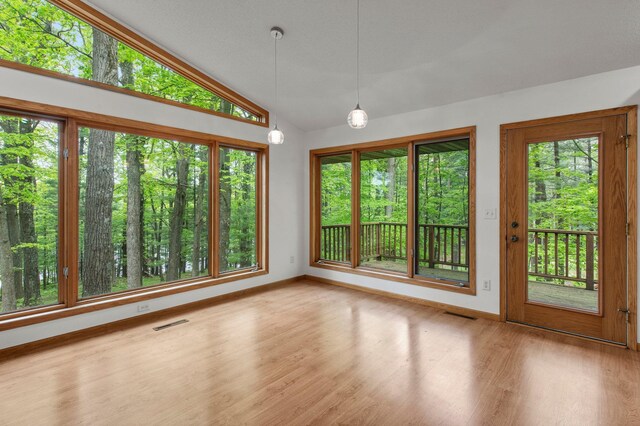 568 26th Ave, Cumberland, WI 54829 - unfurnished dining area featuring baseboards, wood finished floors, and lofted ceiling