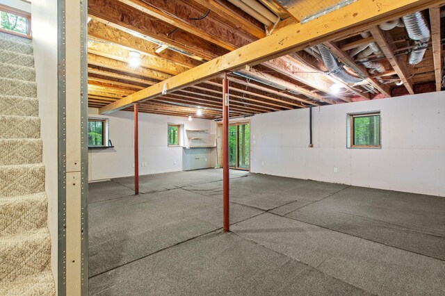 568 26th Ave, Cumberland, WI 54829 - below grade area featuring plenty of natural light and stairs