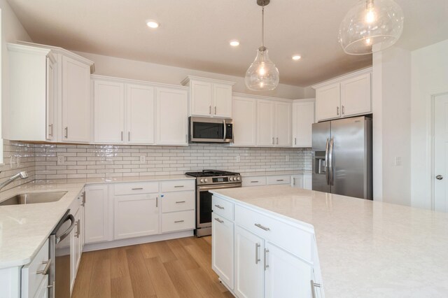 4623 Obsidian Way, Victoria, MN 55386 - kitchen with stainless steel appliances, light wood-style flooring, recessed lighting, and white cabinets