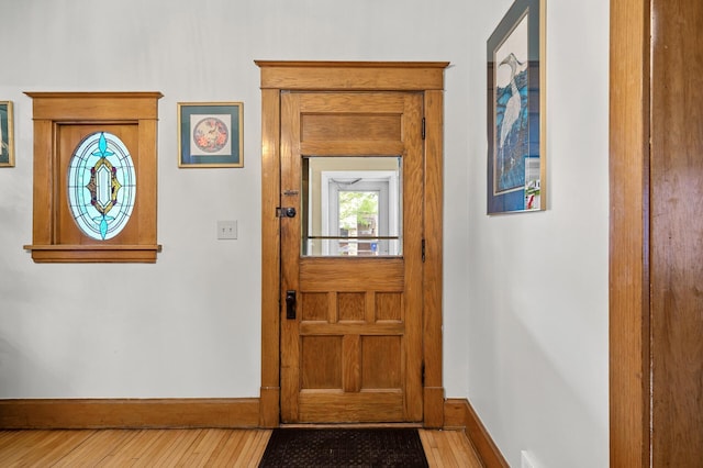 658 Plum St, Saint Paul, MN 55106 - foyer entrance with baseboards and hardwood / wood-style floors