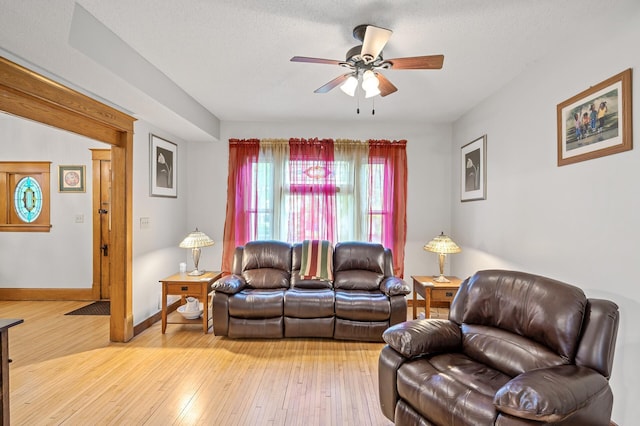 658 Plum St, Saint Paul, MN 55106 - living room with a ceiling fan, light wood-type flooring, and baseboards