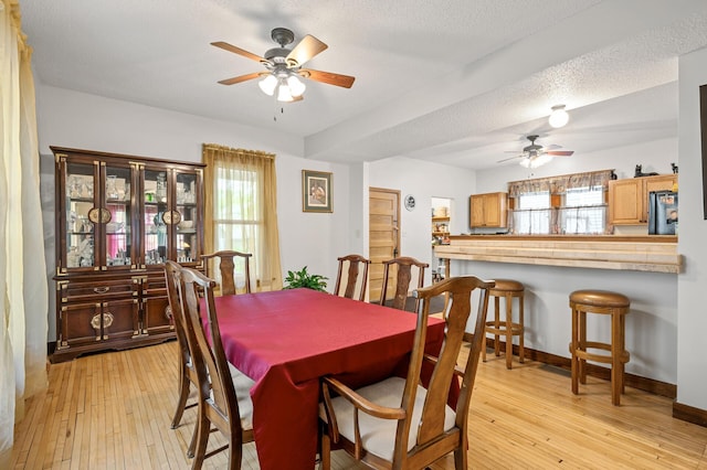 658 Plum St, Saint Paul, MN 55106 - dining room with ceiling fan, light wood finished floors, and plenty of natural light