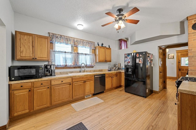 658 Plum St, Saint Paul, MN 55106 - kitchen with black appliances, a sink, light countertops, a ceiling fan, and light wood-type flooring