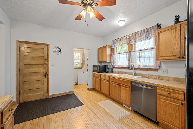 658 Plum St, Saint Paul, MN 55106 - kitchen featuring dishwasher, a sink, black microwave, a textured ceiling, and a ceiling fan