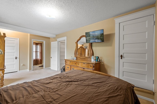658 Plum St, Saint Paul, MN 55106 - carpeted bedroom with a textured ceiling and baseboards