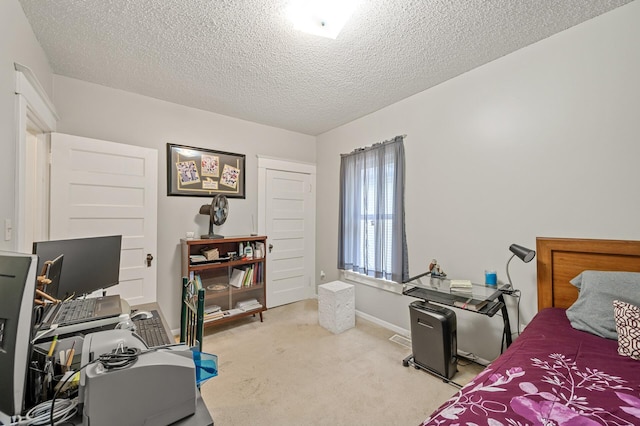 658 Plum St, Saint Paul, MN 55106 - carpeted bedroom featuring an office area, a textured ceiling, and baseboards