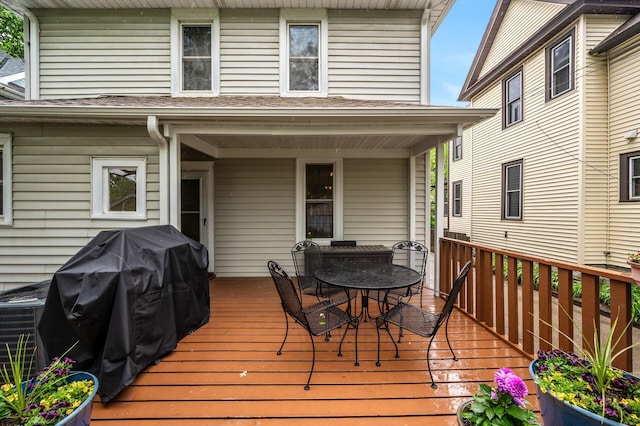 658 Plum St, Saint Paul, MN 55106 - deck with outdoor dining area and a grill