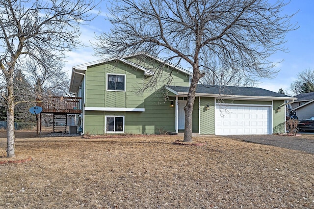 view of front of house with dirt driveway, a garage, and a wooden deck