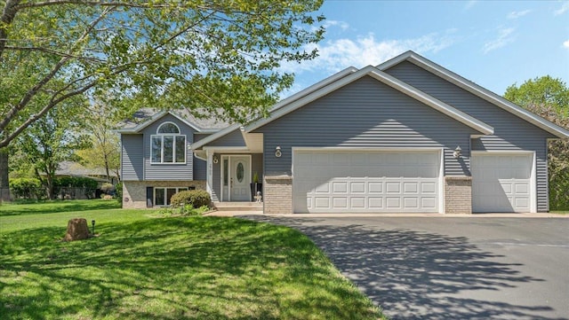 2705 Serenity Dr, Saint Cloud, MN 56301 - view of front of house with an attached garage, brick siding, and driveway