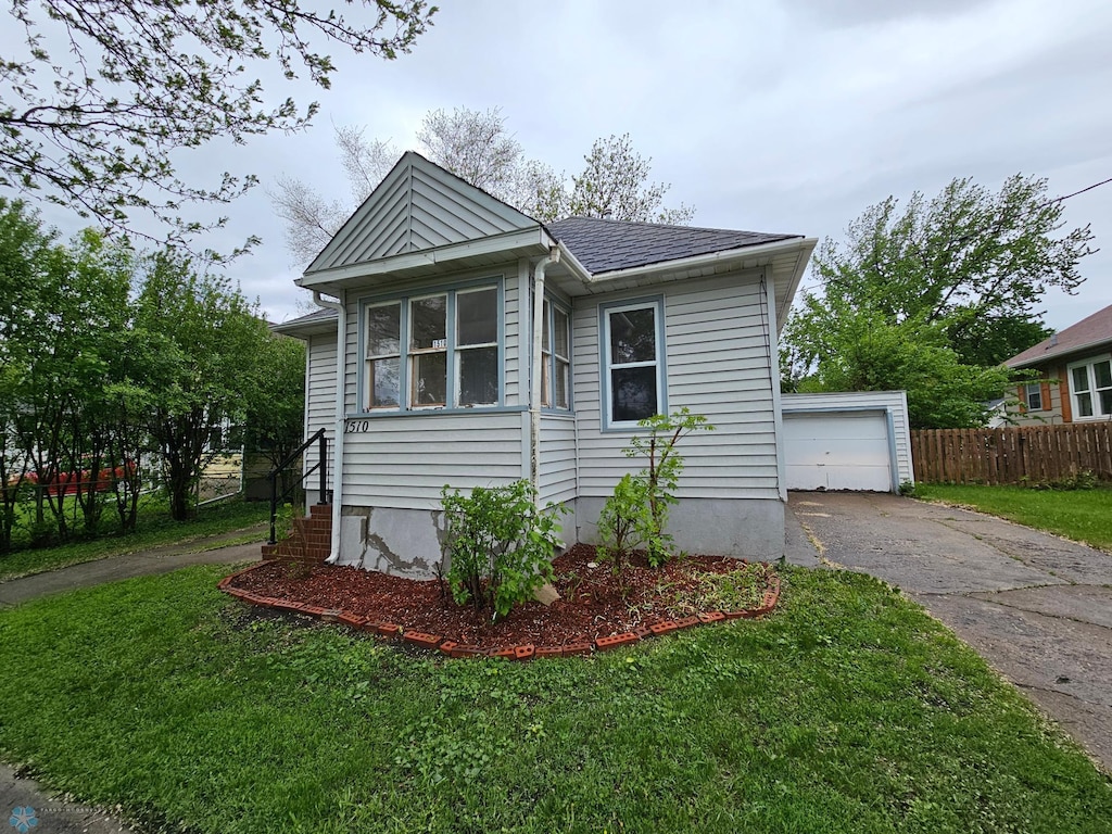 1510 5th Ave S, Fargo, ND 58103 - view of front facade featuring asphalt driveway and an outdoor structure