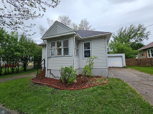 1510 5th Ave S, Fargo, ND 58103 - view of front facade featuring asphalt driveway and an outdoor structure