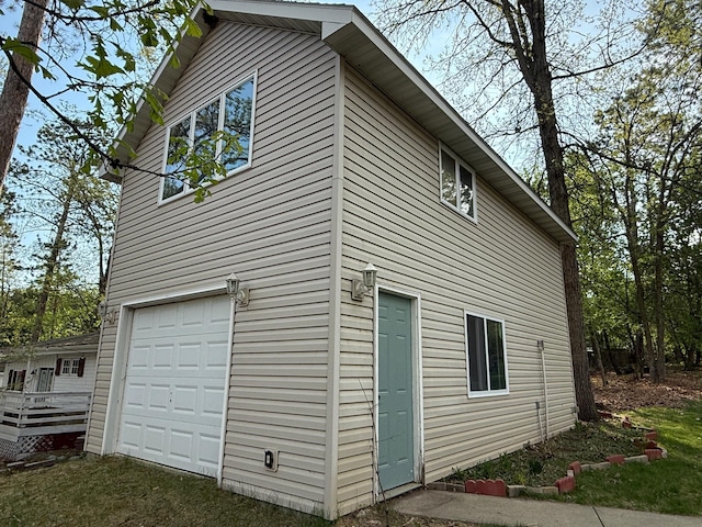 5502 Mallard Ln NE, Bemidji, MN 56601 - view of side of home featuring an attached garage