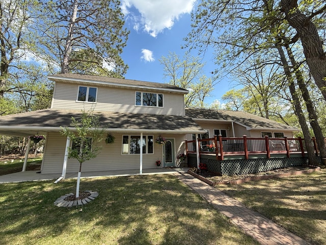 5502 Mallard Ln NE, Bemidji, MN 56601 - view of front of home featuring a front lawn, a wooden deck, and roof with shingles