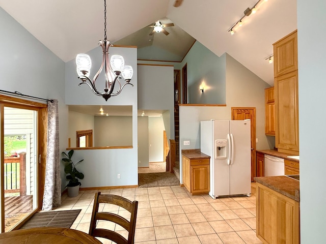 5502 Mallard Ln NE, Bemidji, MN 56601 - kitchen featuring white appliances, light tile patterned floors, high vaulted ceiling, track lighting, and a chandelier
