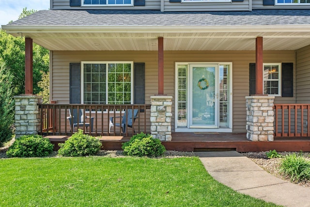 19883 Evensong Ct, Farmington, MN 55024 - view of exterior entry with a porch, a shingled roof, and a lawn