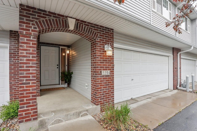 3394 Spring Glen Cir NW, Prior Lake, MN 55372 - view of exterior entry featuring brick siding and a garage