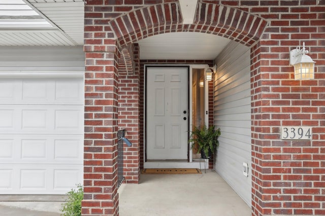 3394 Spring Glen Cir NW, Prior Lake, MN 55372 - doorway to property featuring a garage and brick siding