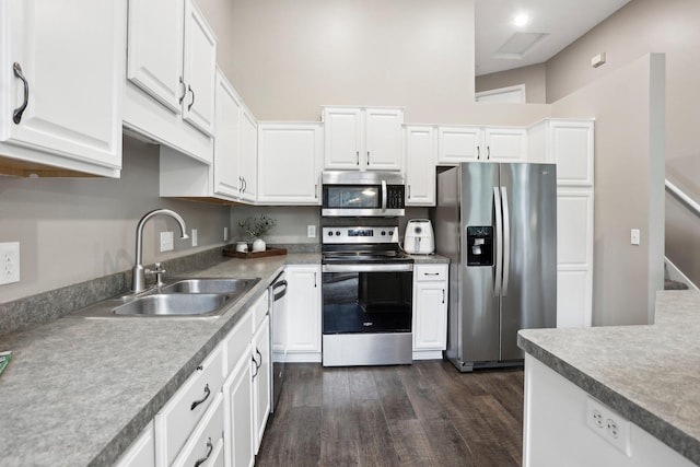 3394 Spring Glen Cir NW, Prior Lake, MN 55372 - kitchen featuring stainless steel appliances, a sink, dark wood-style flooring, and white cabinets