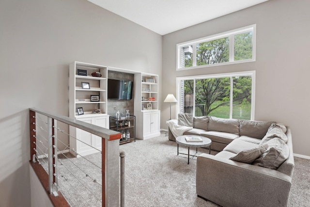 3394 Spring Glen Cir NW, Prior Lake, MN 55372 - carpeted living area with a high ceiling and baseboards