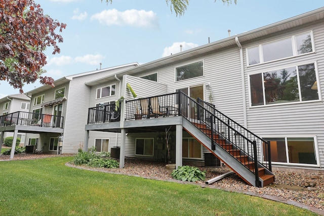 3394 Spring Glen Cir NW, Prior Lake, MN 55372 - back of house with stairway, a deck, a yard, and central AC unit