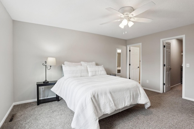 3394 Spring Glen Cir NW, Prior Lake, MN 55372 - carpeted bedroom with baseboards, a ceiling fan, a spacious closet, and ensuite bath
