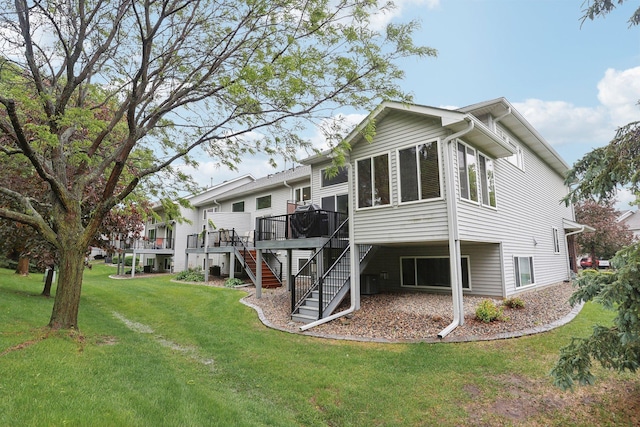 3394 Spring Glen Cir NW, Prior Lake, MN 55372 - back of house featuring stairs, a deck, and a yard