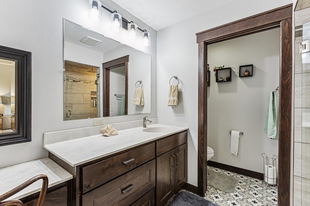 10798 Quiner Ave NW, Southside Twp, MN 55382 - full bathroom featuring vanity, toilet, tiled shower, and baseboards