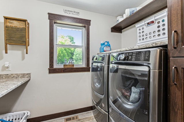 10798 Quiner Ave NW, Southside Twp, MN 55382 - laundry room featuring washer and clothes dryer and baseboards
