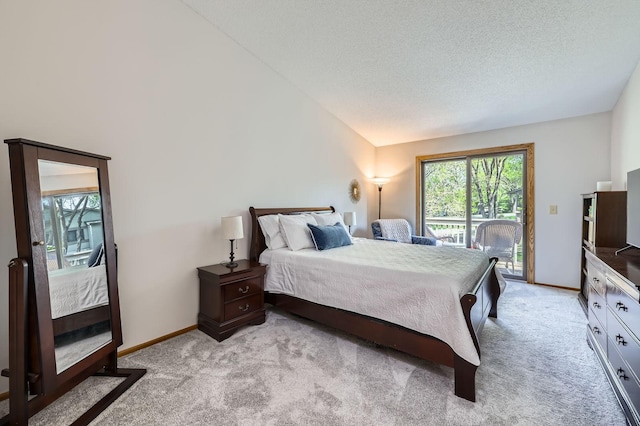bedroom with access to outside, light colored carpet, lofted ceiling, baseboards, and a textured ceiling