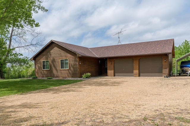 24058 610th Ave, Madison Lake, MN 56063 - view of front of house with dirt driveway, an attached garage, and roof with shingles