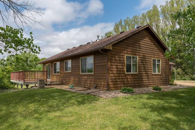 24058 610th Ave, Madison Lake, MN 56063 - view of property exterior with a wooden deck, a yard, and central AC