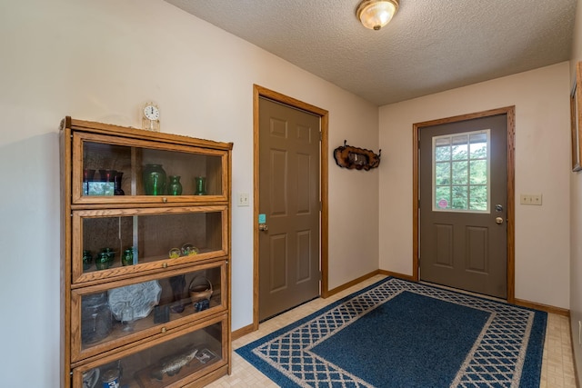 24058 610th Ave, Madison Lake, MN 56063 - foyer featuring a textured ceiling and baseboards