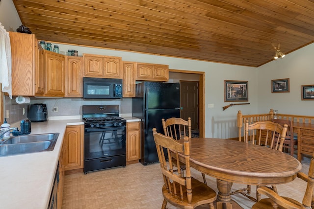 24058 610th Ave, Madison Lake, MN 56063 - kitchen featuring black appliances, a sink, vaulted ceiling, wood ceiling, and light countertops