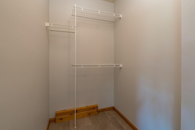 24058 610th Ave, Madison Lake, MN 56063 - walk in closet featuring wood finished floors