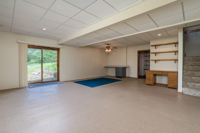 24058 610th Ave, Madison Lake, MN 56063 - unfurnished living room with speckled floor, stairway, a ceiling fan, a paneled ceiling, and an office area