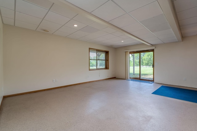 24058 610th Ave, Madison Lake, MN 56063 - empty room with speckled floor, baseboards, and a paneled ceiling