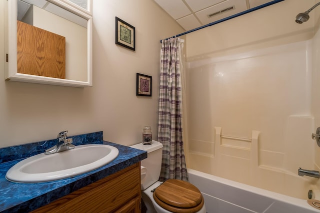 24058 610th Ave, Madison Lake, MN 56063 - bathroom with shower / bathtub combination with curtain, toilet, vanity, and a paneled ceiling