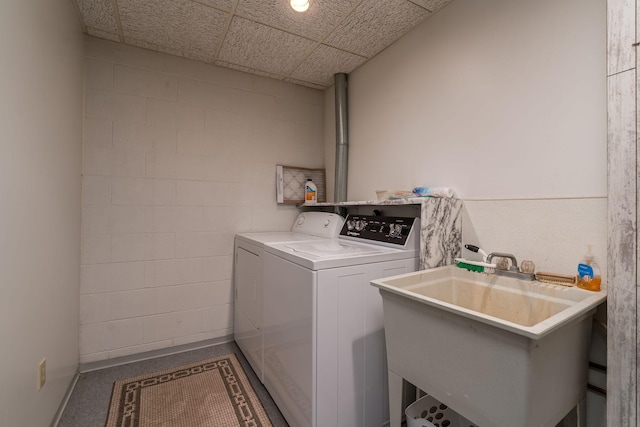 24058 610th Ave, Madison Lake, MN 56063 - laundry room featuring separate washer and dryer, concrete block wall, and baseboards