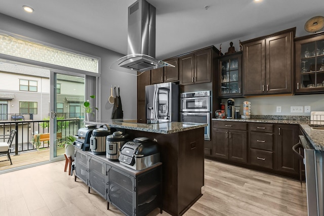 4014 River Valley Way, Eagan, MN 55122 - kitchen featuring island range hood, appliances with stainless steel finishes, dark brown cabinets, light wood finished floors, and recessed lighting