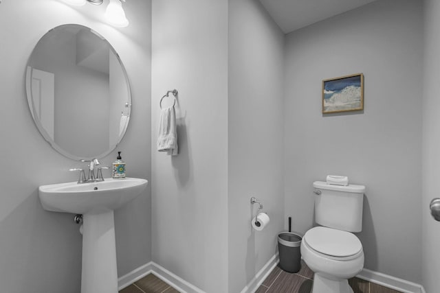4014 River Valley Way, Eagan, MN 55122 - half bathroom featuring toilet, baseboards, and wood finished floors
